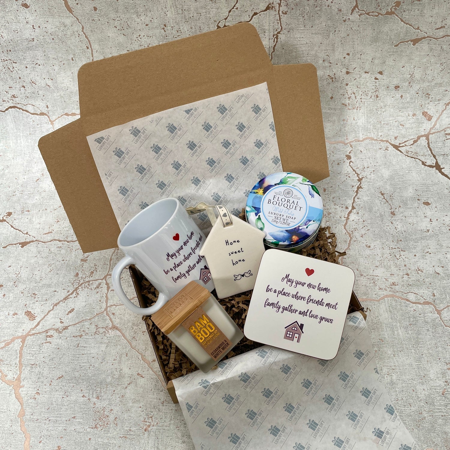 new home gift box with assortment of gifts